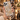 White bow crystal phone case held in hand in a luxury setting