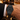 Suspended skull dial watch worn on wrist, luxury lifestyle